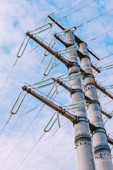 High-voltage tower on a blue sky