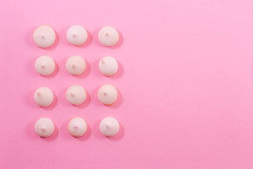 Zephyr biscuits on a light pink-red background.