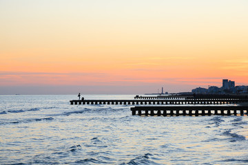 Beach at dawn, piers perspective view