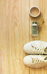 Woman accessories set on wooden background. Top view