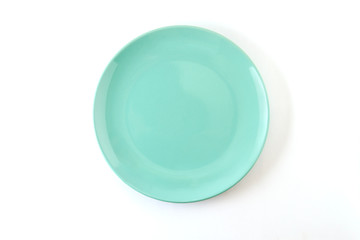 A plate of pastel turquoise color on a white background.