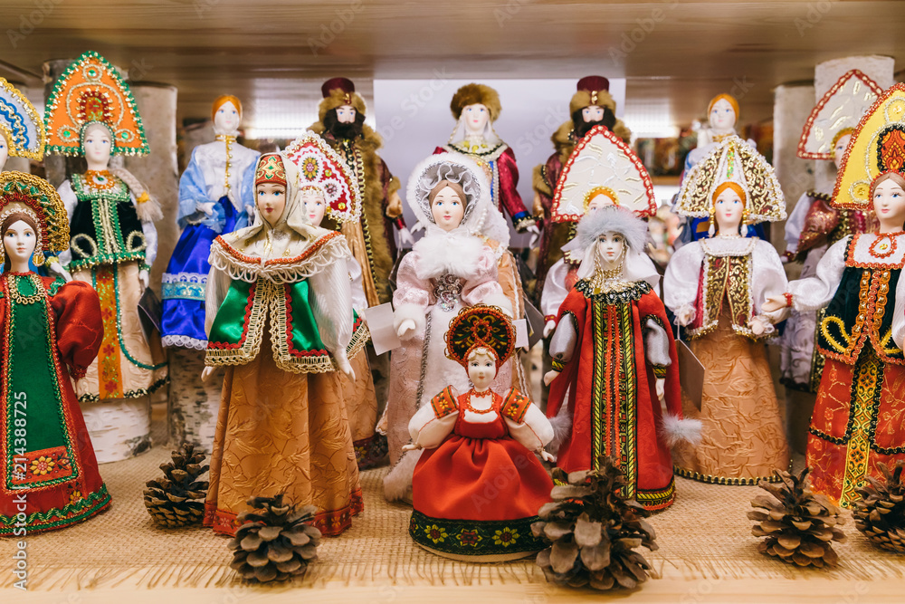 Wall mural Russian souvenirs handmade doll in the traditional dress and hen