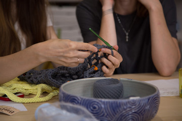 Knitting workshop. Girls crocheting a string bag. Plastic Pollution Problem solution