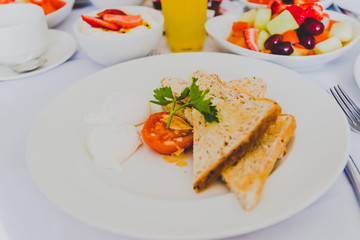 breakfast table with healthy poached eggs and toast