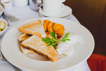breakfast table with healthy poached eggs and toast