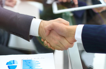 Business handshake. Close-up of business men shaking hands.