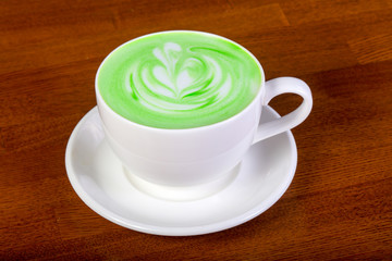 Green cappuccino with cream
