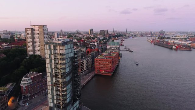 Aerial view of amazing sunset at port of Hamburg, Germany. Boats, ships and beautiful buildings.