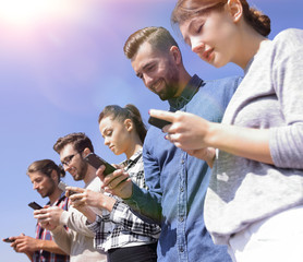 young people using smartphones to search network