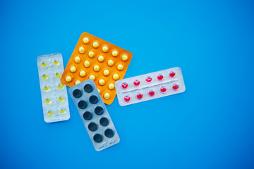 Medical Pills. Colored Pills And Capsule On Blue Background. Pharmacy Theme, Capsule Pills With...
