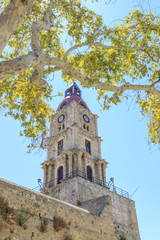 Fototapeta na wymiar Medieval clock tower roloi in old town Rhodes, Dodecanese, Greece