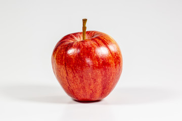Red apples waiting to be eaten on the kitchen table