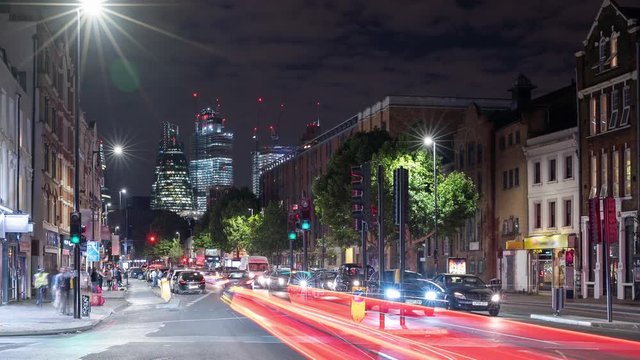 Timelapse of London traffic against skyline at night
