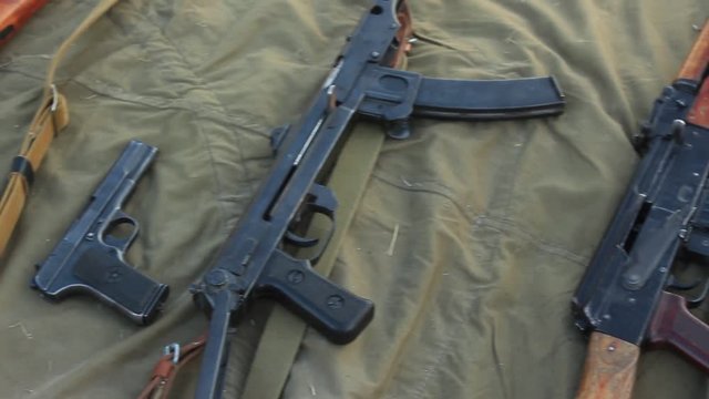 Soldier in Camouflage Uniform with the Machine Gun, Bandolier