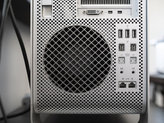 The back of a Mac Pro aluminium cabinet with airvent and ports