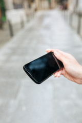Close-up of a smartphone held by hand