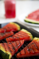 Grilled watermelon in grilling pan, close-up. Selective focus.