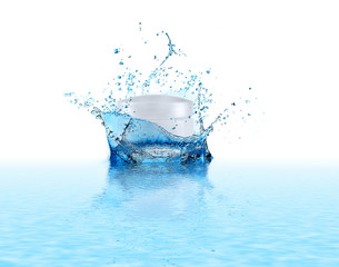 Cosmetic product and splashing water on white background. Beauty and skin care