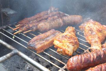 sausages fried on the grill at the market stall during the festivity