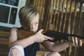 Young Boy Shooting BB Gun