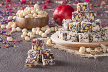 Fototapeta na wymiar turkish delight with nuts and pomagranate