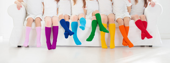 Kids with colorful socks. Children footwear.