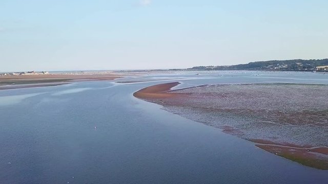 Lympstone bay, tide out, United Kingdom. Epic rising aerial view.