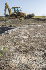Obraz premium Backhoe machine at archeological excavation
