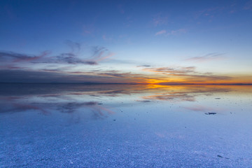 Uyuni reflections are one of the most amazing things that a photographer can see. Here we can see how the sunrise over an infinite horizon with the Uyuni salt flats making a wonderful mirror. 