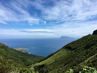 Fototapeta premium A valley and Corvo Island on the background