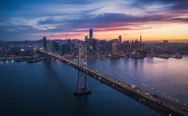 Fototapeta na wymiar Aerial Cityscape view of San Francisco and the Bay Bridge with Colorful Sunset