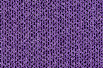 Purple piece of fabric close-up with a clear repeating pattern