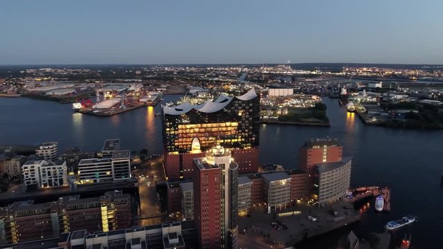 Aerial View of Elbphilharmonie and HafenCity at sunset, Hamburg, Hanseatic City. City lit up at night, Hamburg, Germany Night city landscape. Amazing architecture.