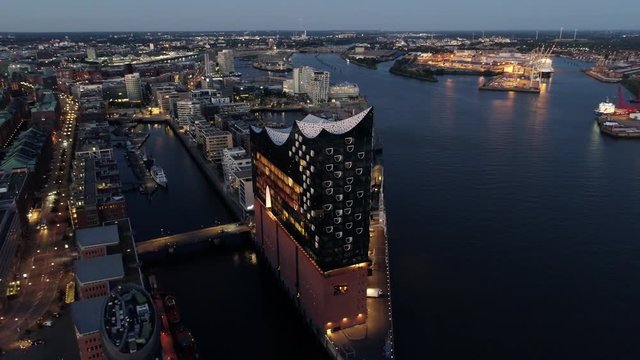 Aerial View of Elbphilharmonie and HafenCity at sunset, Hamburg, Hanseatic City. City lit up at night, Hamburg, Germany Night city landscape. Amazing architecture.