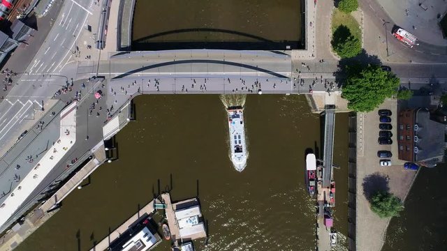 Aerial view of Hamburg, Hafencity (Germany). Boat under the bridge on river Elbe