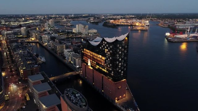 Aerial View of Elbphilharmonie and HafenCity at sunset, Hamburg, Hanseatic City. City lit up at night, Hamburg, Germany Night city landscape. Amazing architecture.