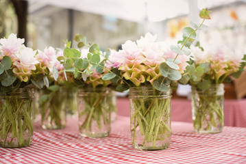 Arrangement of flowers at a farmers market, ginger plants blooming 