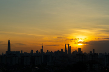 Majestic sunset over KL Tower and surrounded buildings in downtown Kuala Lumpur, Malaysia.	