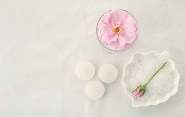 Fototapeta na wymiar Beautiful composition of spa treatment on white tissue background, monochrome pastel concept
