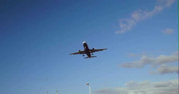 Commercial Airplane Landing at Heathrow International Airport.