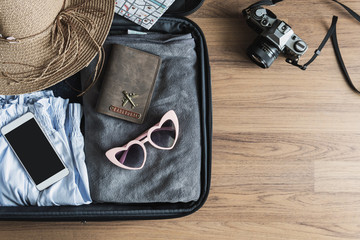Traveler baggage with clothes and accessories, Travel vacation trip concept