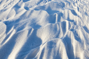 Fototapeta na wymiar Snowdrifts, a field in winter