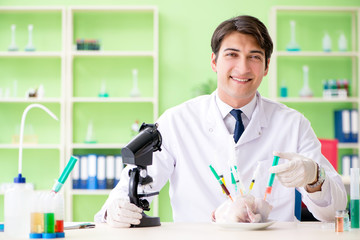 Lab assistant testing GMO chicken