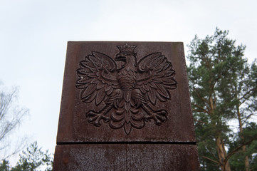 The Polish coat of arms. Polish memorial in the village of Mednoe, Tver region