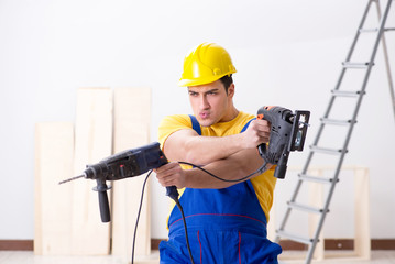 Floor repairman disappointed with his work 