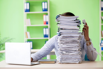 Businessman having problems with paperwork and workload - obrazy, fototapety, plakaty