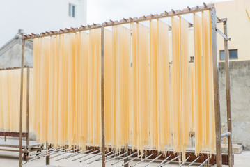 Traditional Chinese noodles drying on the rack - 214415115