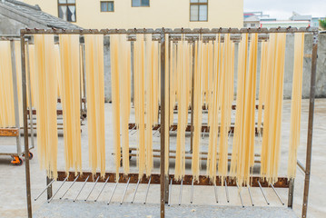 Traditional Chinese noodles drying on the rack - 214415156
