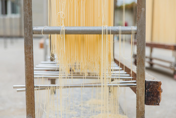 Traditional Chinese noodles drying on the rack - 214415157