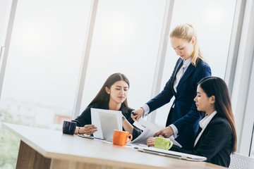 business meeting consult with caucasian woman manager and asian officer teamwork ideas concept